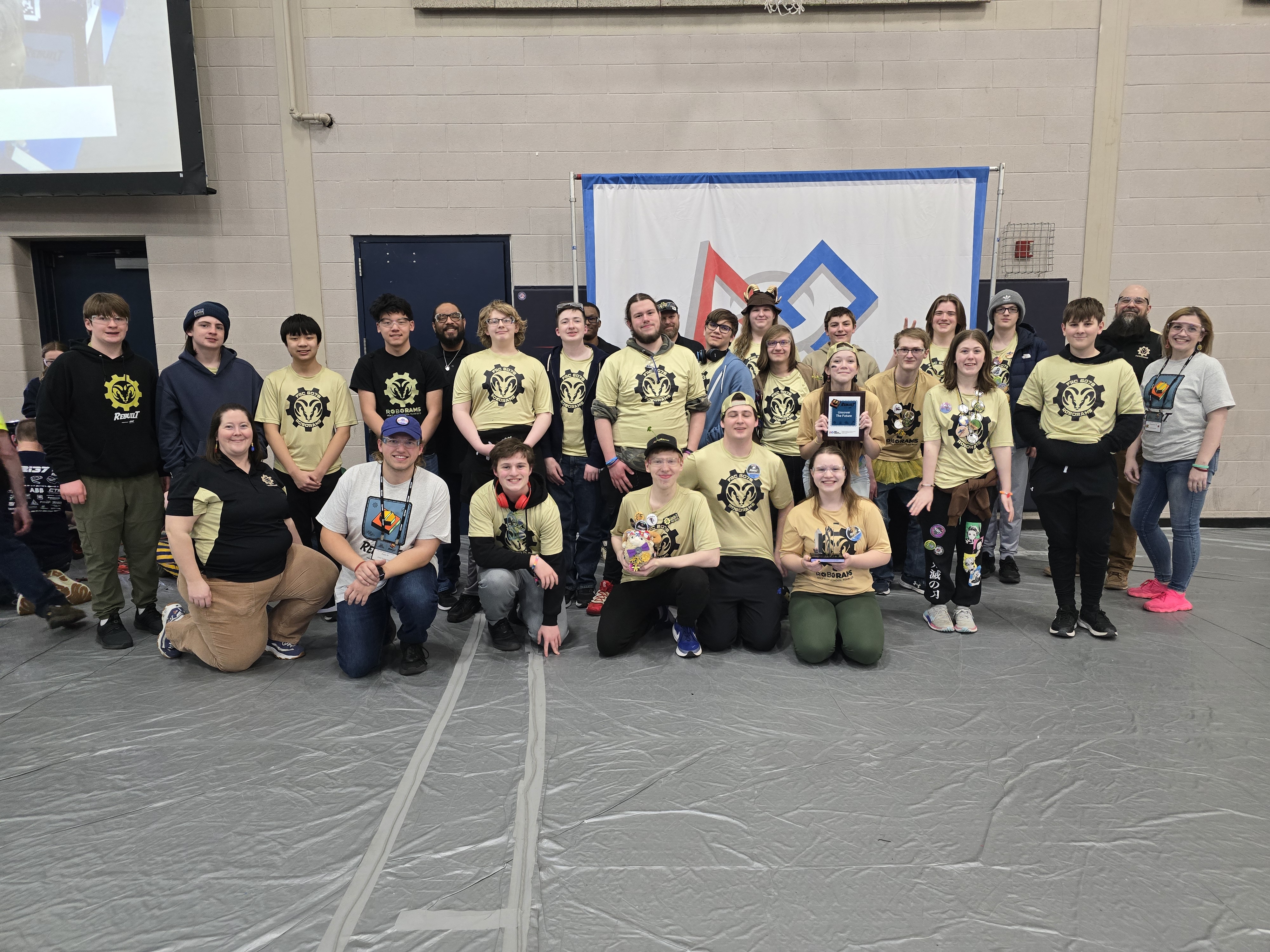 Holt Robotics RoboRams students after winning an award.