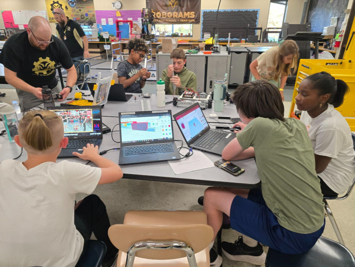 FTC students building and testing robot components.